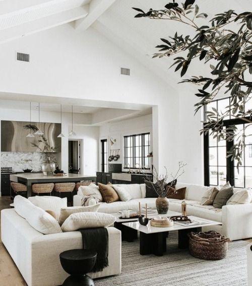 Love this beautiful modern living room design with a large sectional, marble coffee tables, and neutral decor and furniture - living room decor - living room furniture - organic modern decor - warm neutral living room - modern earthy living room ideas - the life styled co